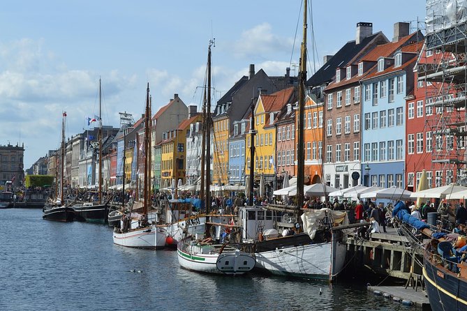 Wooden masts and gabled houses along the Nyhavn canal in Copenhagen