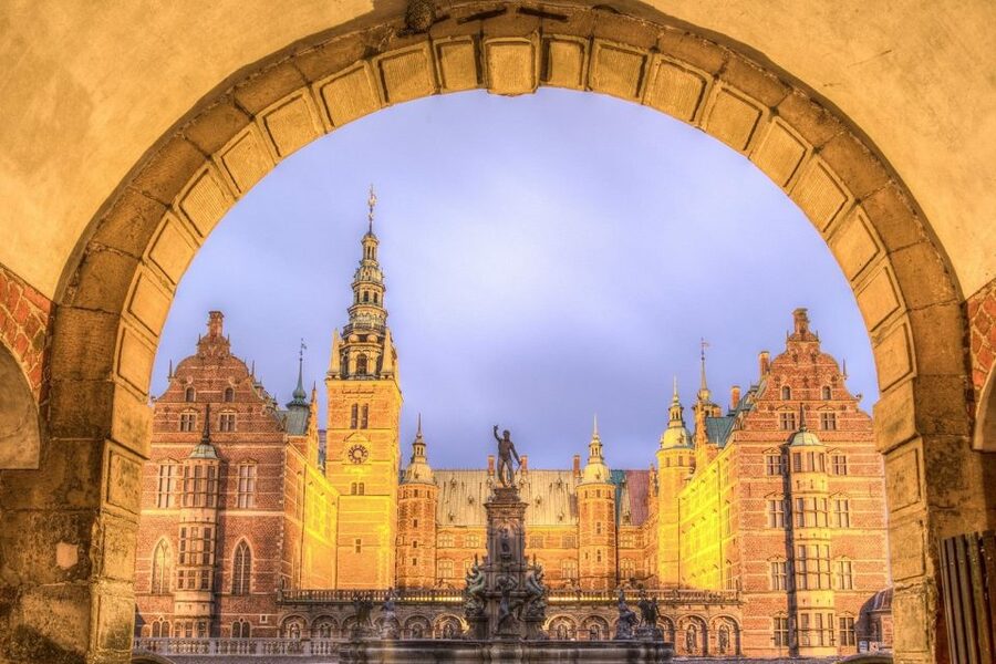 From Copenhagen: Private Frederiksborg Castle Tour - Approaching the palace beside the lake